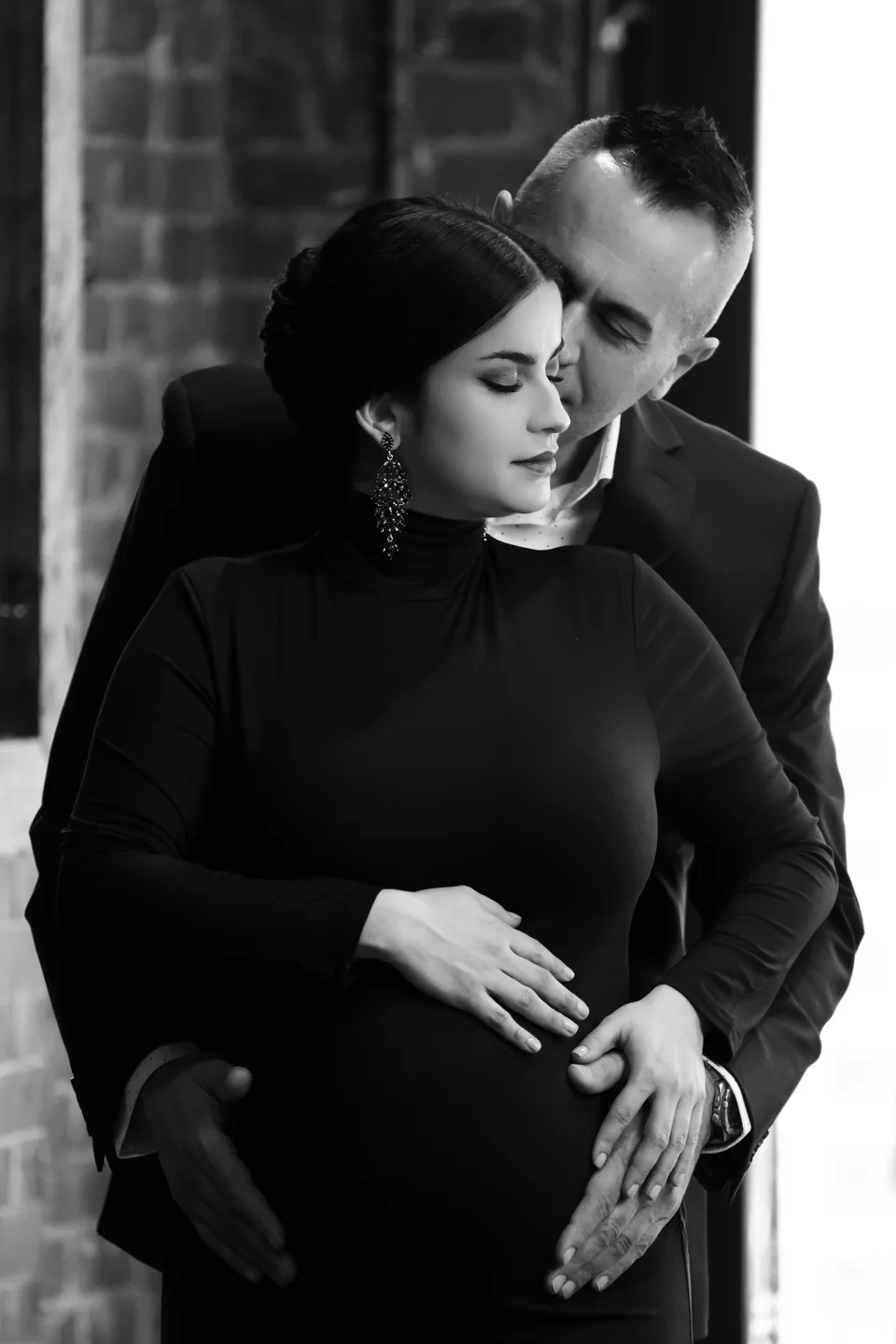 Black-and-white couple portrait in a close embrace
