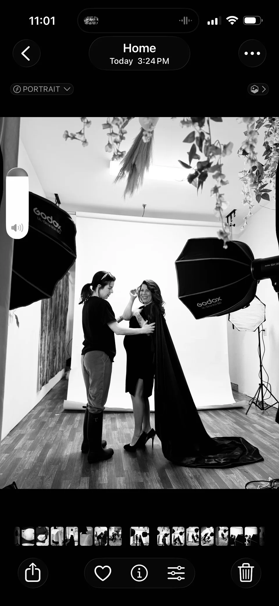 Behind-the-scenes photograph of lighting equipment and a model