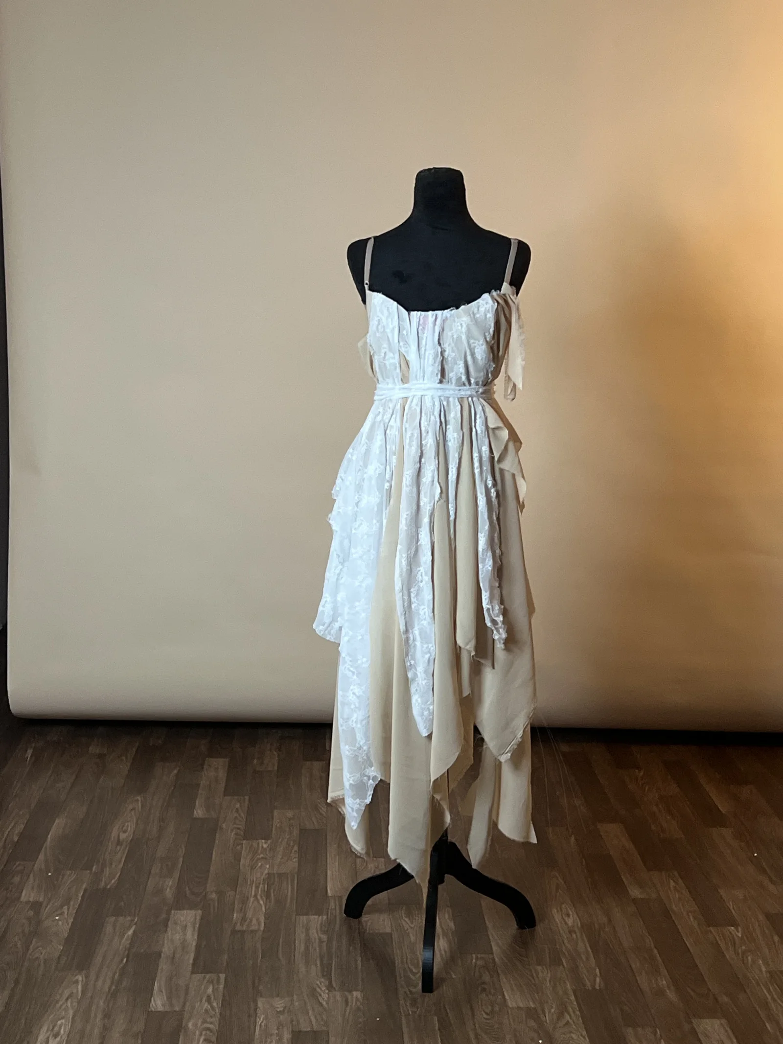 White dress displayed on a dress form