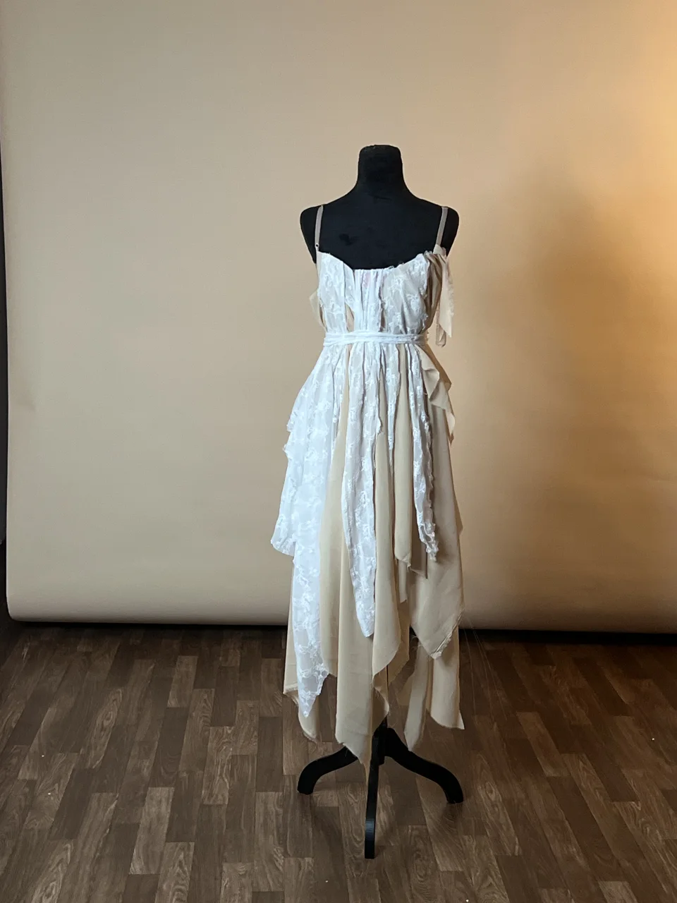 White dress displayed on a dress form