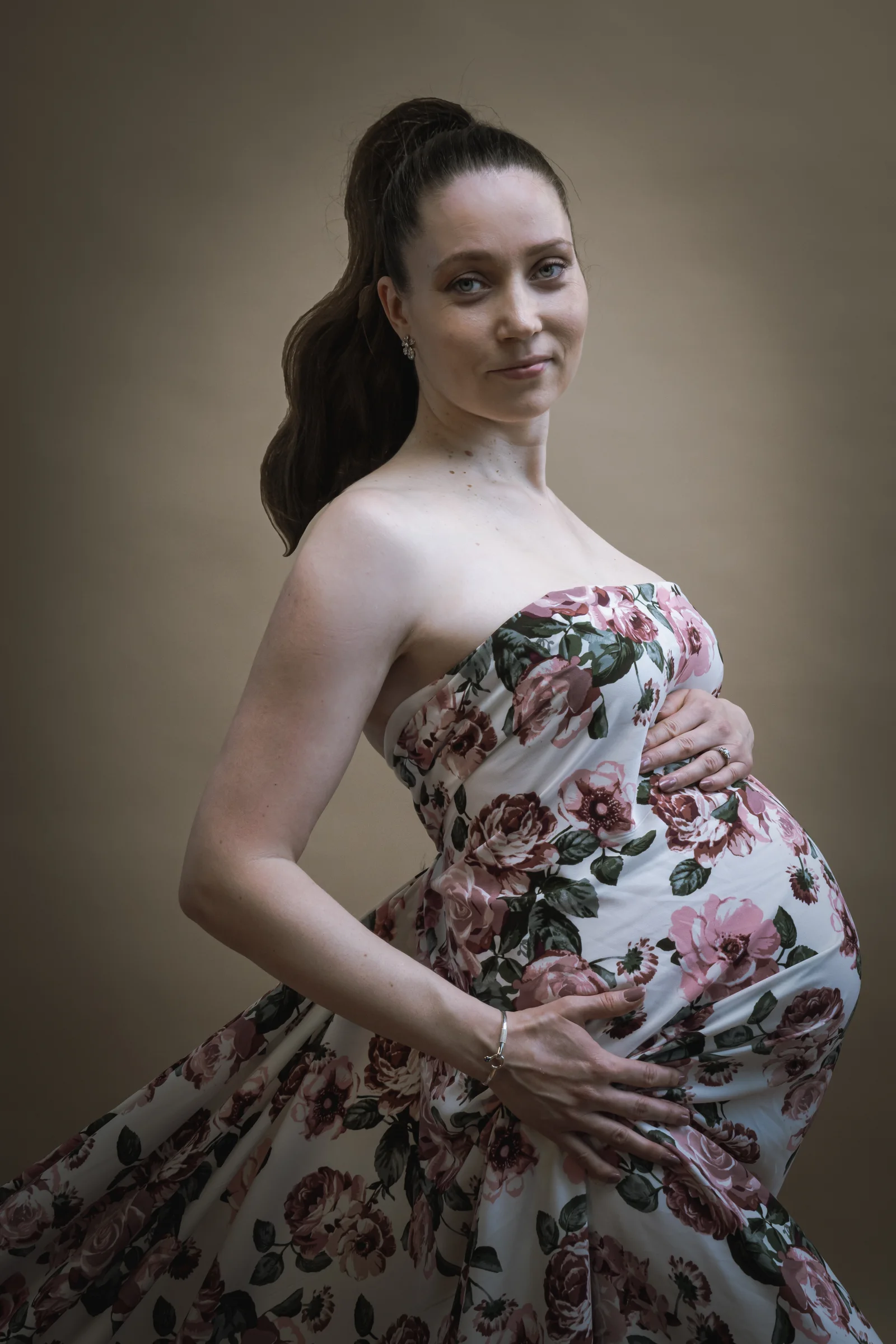 Maternity portrait in a strapless floral gown